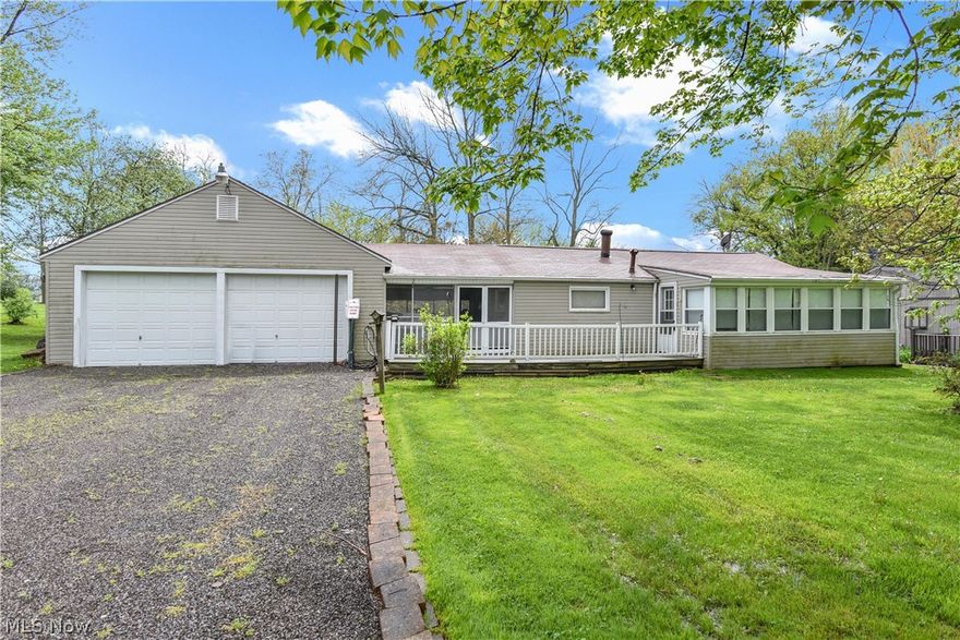 Charming summer lake cottage at Berlin Lake. Ranch style with open Kitchen/Family Room, spacious Master Bedroom with laundry area, Huge screened porch, and 2 car garage, all situated on a 0.72 acre lot. Steps away from the lake. home includes private dock!