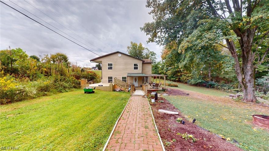 Spacious 2 story home that has had numerous upgrades & remodeling.  This 4-5 bedroom residence is still  undergoing some transformation and putting on some needed final touches inside and out,  but owner is anxious for you to see what has been completed so far.  Nestled on approximately  0.58 acres, this peaceful setting offers a tranquil place and offers many modern amenities.
Key features: 4-5 bedrooms: ample space for your family's needs.
New Vinyl Plank flooring: Throughout most of the home. Remodeled Kitchen: With newer appliances.  New Furnace and Air to  enjoy year-round comfort.  New Gas Line (2020).  New plumbing with PEX.  Charming sunroom: with heat and air for year-round enjoyment.  New Decks and upper balcony and a Pergola: Perfect for outdoor gatherings. This home has so much to offer a new family.