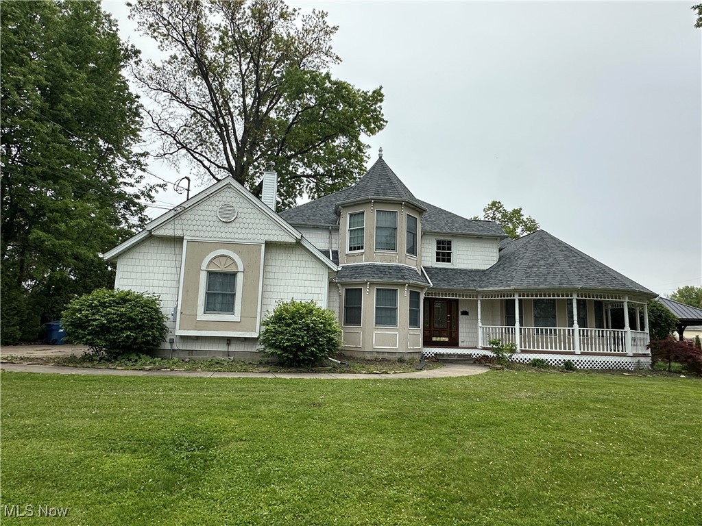 Multiple offers deadline: 6-27-25 2:00PM EST. Live across the street from the Lake! This large 3 bedroom home is across the street from Lake Erie with a decent view! The wrap porch offers charm and appeal. First floor dining room, living room with built in bar area, upgraded counter tops in kitchen, hardwood flooring, new carpet/pad, fresh/new neutral paint throughout, new roof, new 50 gallon hot water tank. Master bath has jet tub, ceramic tile. Good sized master bedroom with turret style ceiling. Full bathroom on each floor. Basement is ready for you to finish as you like. Plenty of storage space. 2+car garage. Vaulted ceilings, recessed lighting, nice fireplace in the family room off the kitchen leads onto the deck in the fenced backyard. Shed in rear. offers vaulted bedroom ceilings, lots of light throughout the home. Property is being sold in as is condition, no further repairs from Seller. Compare and save. Cash, conventional or rehab loan applicable.