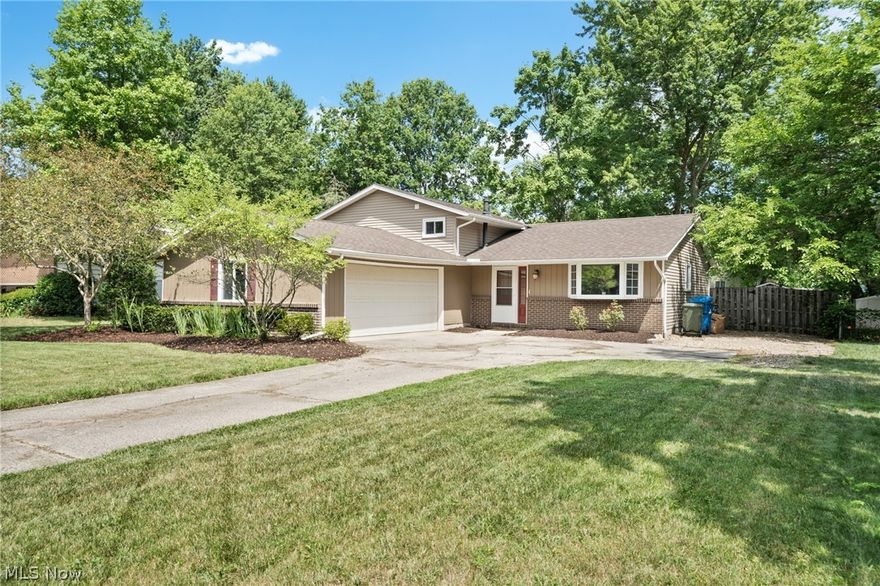 Beautiful home with loads of charm and wonderful fenced in back yard lot.  The open foyer will surprise you as you enter the large Kitchen with granite countertops and breakfast bar/white cabinetry/neutral ceramic tiling followed by a cozy dining area with access to the back yard hot tub and newly built pergula and for the night time entertaining, a wood burning firepit will impress your guests.  The lower level boasts new carpeting/fresh paint and access to 1/2 bath and large landry area.  The updated upper level full bath has dual sinks, all bedrooms have hardwood flooring and fresh paint and decor...you will love this home!!