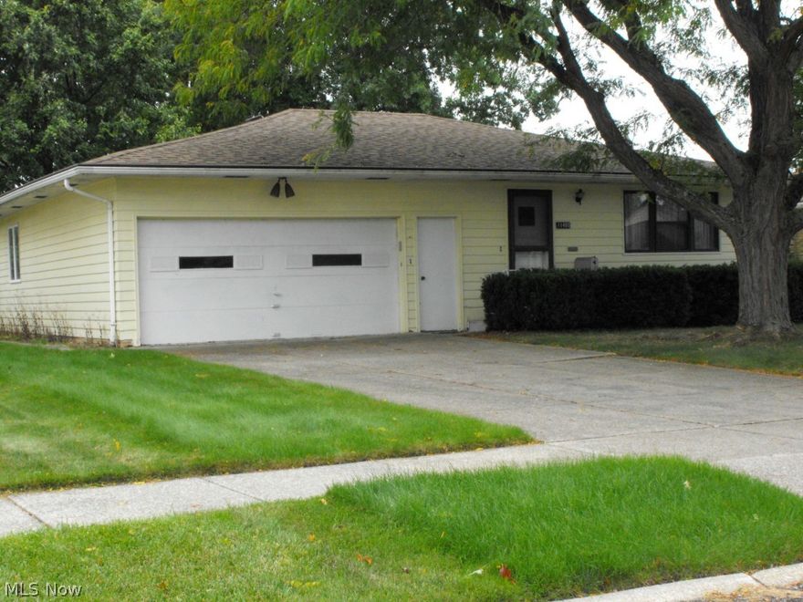 Spacious 1308 sqft center hall ranch with 2 car attached garage. 3 Bedrooms with good closet space and beautiful hardwood floors. 1.5 Baths with half bath off family room. Large eat-in kitchen with pantry and also formal dining room. Family room exits to Large patio in 60x227 yard. Hardwood also under living room carpet. Natural woodwork throughout. Updates include newer rood & windows in most rooms. Great street in a good location. Close to everything. Won't last!