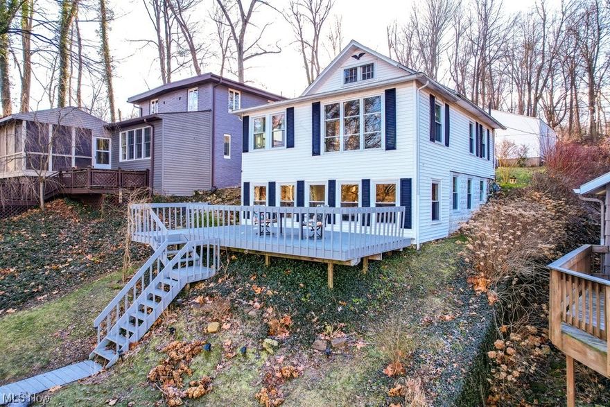 Welcome home to 191 Sycamore Dr. This is a Fantastic and truly rare opportunity to join the desirable and unique Willowdale Lake Community. This charming, move-in ready, waterfront cottage has so much to offer. In the front – a large deck with a stunning view, to enjoy all summer with friends and family. As we enter through the lower level, we are greeted by the bright and welcoming living space - offering an abundance of natural light. Prepare your favorite meals in this fully renovated (2019) kitchen, equipped with all stainless-steel appliances.  Upstairs, you will find, two bedrooms and a full bath. The living room offers a great view through the large panoramic window. Outback, after a long day, you will enjoy soaking in the hot tub in the peaceful and private back yard. Enjoy your private membership on Willowdale Lake, complete with the member clubhouse, beach, a bar and grill, a patio and pavilion, a playground and basketball court, boating, fishing, hunting, kayaking, and swimming. Living here feels like you are on vacation year-round. Willowdale lake is a hidden treasure in Jackson Township, located near shopping, restaurants, the airport and I-77, yet quiet and secluded!!! Schedule your private tour today! Electric motors only. Agent owned!