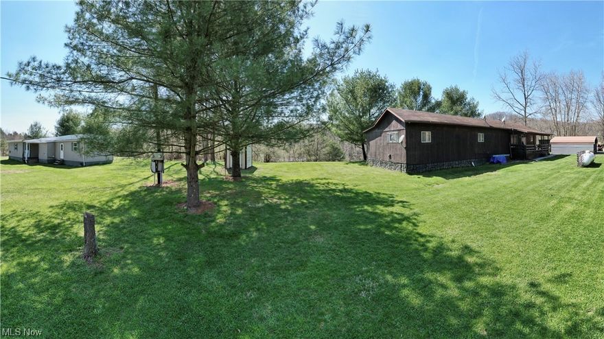 Beautiful 51.8 acres tract! 2 mobile homes on property with outbuildings. One mobile home currently rented and 1 recently remodeled.  Nice recreational tract with trails throughout.  Property has free gas and 1 well and 2 septics.  Perfect for a hunting getaway or build your dream home.