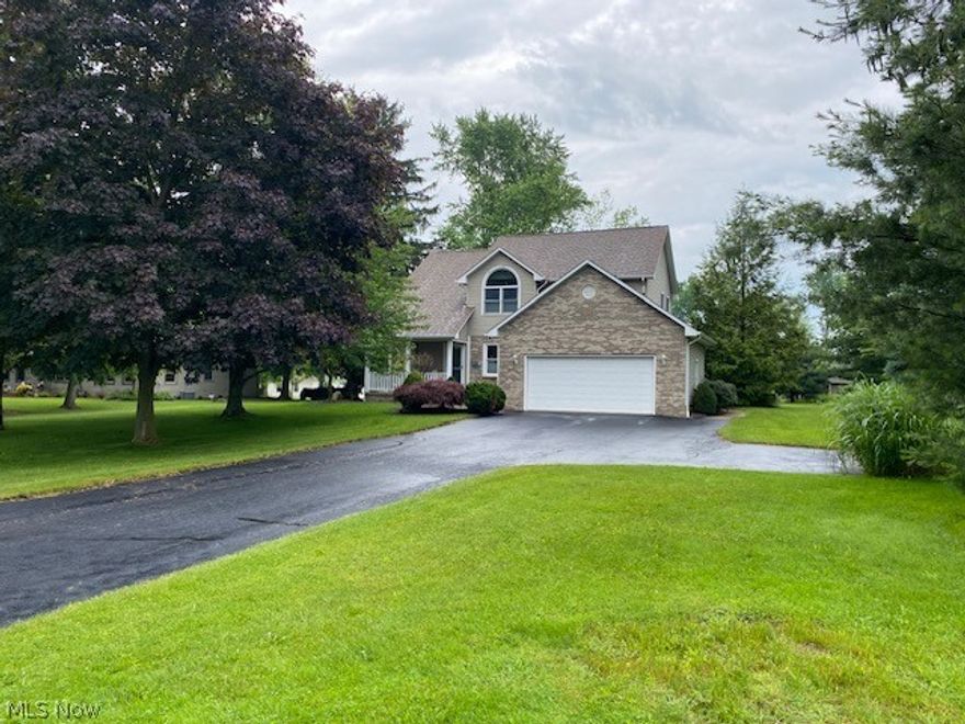 Welcome to this lovely three bedroom two story with a two car garage in a natural green setting featuring plenty of room inside and out!  The long driveway with turnaround leads to this meticulously landscaped home with a welcoming, wraparound porch and decorative front door.  A two story foyer and formal dining room open to the living room with fireplace enhanced by double doors to the newly stained large deck with a panoramic view of the back yard. Light and bright with numerous windows highlighted by up/down shades throughout for sun and privacy. The spacious kitchen includes all appliances, natural oak cabinets and desk and light countertops. The dinette features a bay window and the  half bath and laundry room round out the first floor.  The sunlit staircase takes you to the second floor featuring a loft overlooking the foyer.  The master suite features dual walk-in closets, bath with shower, vanity and commode and two additional bedrooms sharing an oversized bath with a tub/shower combo. Updates include furnace and a/c-2018, roof-2012, glass block windows, 2020, kitchen flooring-2021 and washer and dryer-2022.