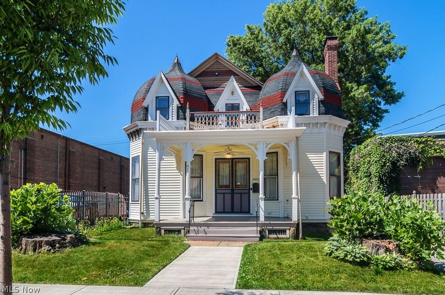 This Victorian Gothic w/ its' Queen Anne twin turrets, is a Cleveland historic landmark.There is no comparable architectural structure anywhere in Cleveland! Meticulously restored in 1992, this home has been updated with amenities including, security, cable, copper plumbing, extravagant hardware, doorplates, knobs and handles. Originally outfitted with only gas lights, proper electrical systems are in place. You will find fireplaces w/ intricate hand carved mantles oak formal staircases exquisitely designed, marble corner sinks, a wine cellar, and even a two story Carriage House on the property. There are four porches and a driveway entrance gate. Historians, millenniums, families, and everyone in between will be in awe of this beautiful home!