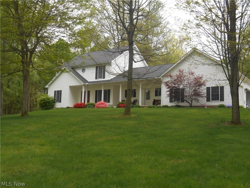 Welcome to paradise!  This wonderful, just like new home is nestled in a 5.2 acre private, wooded park-like setting which seems like your in the country but is located just minutes from everything!  This gorgeous home was built in 2004 and is in mint condition.  Lovely kitchen with cathedral ceiling, large island with eating bar, under and over cabinet 
lighting, stainless steel appliances and Corian counters, sunny dinette, awesome great room with new carpet and fireplace with stone surround.  The first floor owners suite is  a private retreat and features a luxury bath with heated whirlpool tub, separate shower and large walk in closet.  The finished lower level has two rec rooms, a built in bar, a half bath and plenty of storage space.  Three car garage, heated above ground pool, storage barn, paver patio and covered porch complete this stunning home and property.