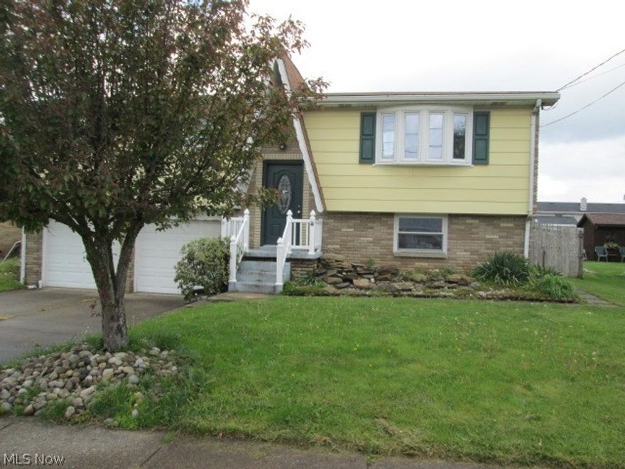 Split entry home with a family room and full bathroom in basement, above ground pool, 3 bedrooms, hardwood floors in bedrooms.