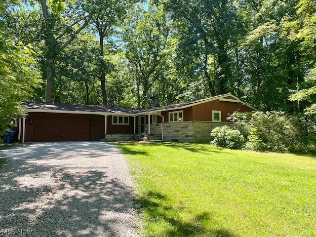 Lovely ranch home nestled on a quiet, beautiful wooded lot! You'll enter through the foyer into the spacious formal living room w/vaulted, wood beam ceiling, TONS of windows that allow lots of natural light to shine through and neutral carpet w/fireplace! Every day, eat in area situated between the living and kitchen areas, spacious enough to seat 6-8 comfortably. The kitchen was renovated and features newer cherry cabinetry, updated appliances and a peek out into the family room. Nice sized family room w/built in shelving and door that leads to backyard, very cozy! The master bedroom is a good size and has it's own full bathroom. Two other generously sized bedrooms and a second full bath complete the first floor. HUGE basement that provides plenty of storage and laundry area plus a second set of kitchen cabinets and extra oven (great to have at holidays or for entertaining!). Updates include roof (2012); furnace (2020), a/c (2021); septic (2013), hot water tank (2020) and well