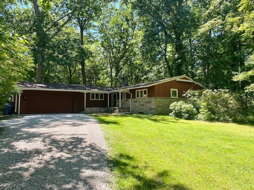 Lovely ranch home nestled on a quiet, beautiful wooded lot!  You'll enter through the foyer into the spacious formal living room w/vaulted, wood beam ceiling, TONS of windows that allow lots of natural light to shine through and neutral carpet w/fireplace!  Every day, eat in area situated between the living and kitchen areas, spacious enough to seat 6-8 comfortably.  The kitchen was renovated and features newer cherry cabinetry, updated appliances and a peek out into the family room.  Nice sized family room w/built in shelving and door that leads to backyard, very cozy!  The master bedroom is a good size and has it's own full bathroom.  Two other generously sized bedrooms and a second full bath complete the first floor.  HUGE basement that provides plenty of storage and laundry area plus a second set of kitchen cabinets and extra oven (great to have at holidays or for entertaining!).  Updates include roof (2012); furnace (2020), a/c (2021); septic (2013), hot water tank (2020) and well