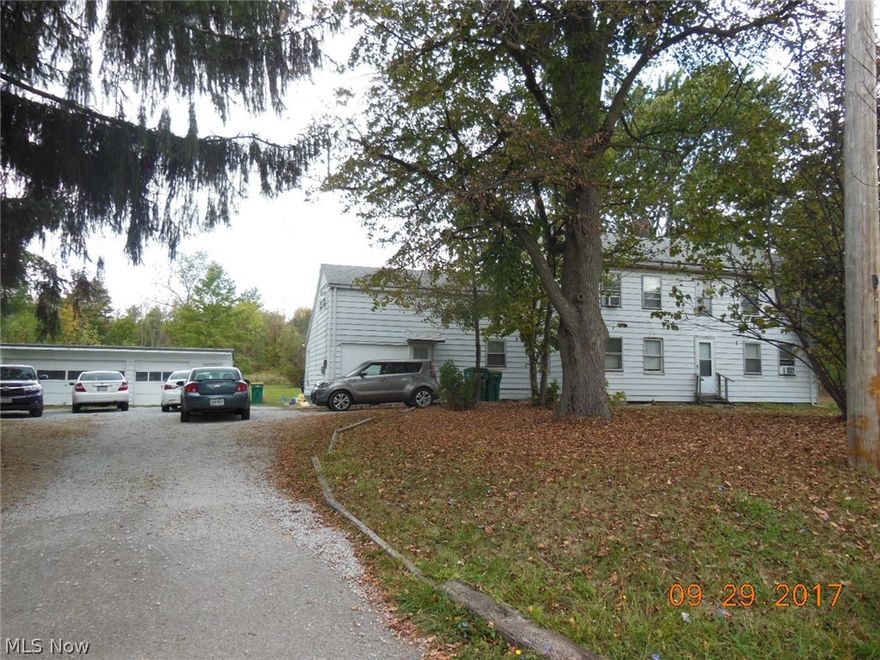 ----CASH BUYERS ONLY --- 3 UNIT APARTMENT BLDG. WITH 3 CAR GARAGE. ALL ALUM.SIDED. ALL IN GOOD CONDITION ! 3 UNITS RENTS ARE LOW AT $1,400 MONTHLY/$16,800 YEARLY!
 SEPARATE GAS/ELEC. FURNACES/HWTS !  TOTAL LAND 4.31 ACRE PARCEL PLUS 1.15 ACRE PARCEL COMBINED TOTAL 5.46 ACRES. WITH  EXCELLENT TOTAL FRONTAGE OF 637 FEET !  FANTASTIC OPPORTUNITY FOR INVESTOR/BUILDER  TO DIVIDE AND KEEP APT.BLDG AND BUILD A  FEW HOMES HOMES OR TEAR DOWN  AND DIVIDE AND BUILD MORE HOMES ! PER CITY --- SANITARY SEWER LATERAL CLEAN OUT IN FRONT YARD, JUST NEEDS CONNECTED TO HOME.   CITY WATER AVAILABLE ACROSS THE STREET !