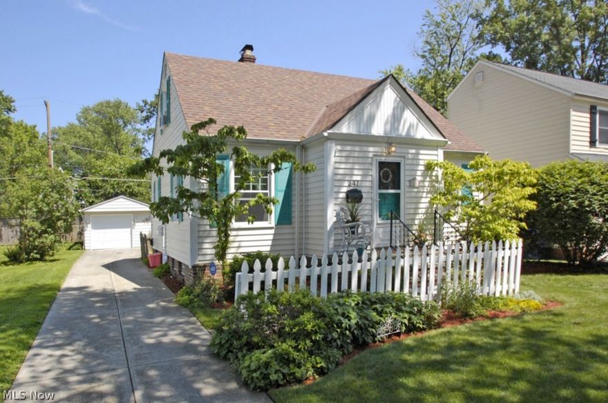 View a slice of the lake from the front porch of this Adorable Cape Cod Bungalow.  This “beachy” cottage home full of charm is MOVE IN ready!  Kitchen has beadboard style cabinets, hardwd flrs & all appliances stay. The dining area adjacent to the kitchen is open to the sunroom.  Enjoy your morning coffee in this sunroom with private deck which overlooks a picket fenced bkyd full of lovely perennials.  All first floor rooms have refinished hardwood floors.  A charming living room w/built in shelves and decorative fireplace, two bedrooms and a full bath complete the first floor.  Upstairs the master suite is light & bright with a full bath,vaulted ceiling with two fans & a skylight.  The lower level has a large rec room, laundry room and a storage/former office area. Basement is water proofed and has a backup sump pump & glass block windows. This home has been lovingly maintained.  Pride of ownership is evident.  Many improvements include newer vinyl siding, many windows replaced and ne