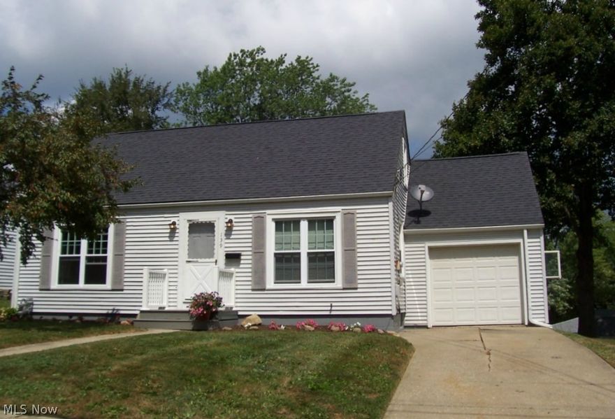 Move in condition. Lovely hardwood floors on the main level. Kitchen and bath cabinetry have been updated. The kitchen countertop, backsplash & vinyl flooring installed 8/2015 along with the carpeting on the second level. Replacement windows, waterproofed basement, insulated garage door, glass block basement windows and numerous other updates. Additional living space in the basement rec room. This home is not a drive-by.