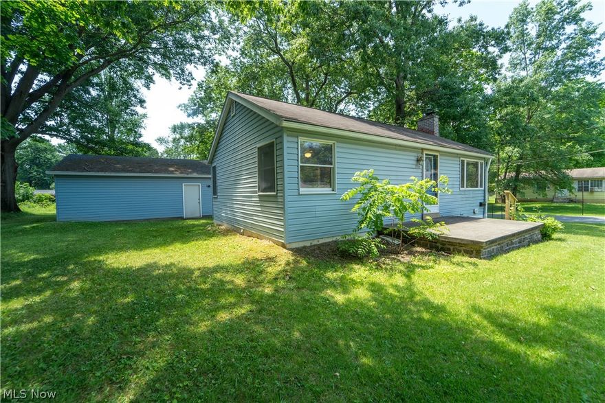 Welcome home to this charming 2 bedroom/ 1 bath ranch home in the Stow-Munroe Falls School district, on a .41 acre lot. 
The Kitchen boasts Oak cabinets, tile backsplash & floors, a composite corner sink, and all appliances. A cozy electric mantled fireplace welcomes you to the Living Room. with its vinyl planked flooring and lg. windows and blinds that allow natural light to enter the room during the day while maintaining nighttime privacy.  Both bedrooms have vinyl plank flooring, ceiling fans, and window blinds. There is a full unfinished basement that could be a future rec room but is currently being used for storage/laundry. The washer and dryer are included in the sale. Outside you will find a fenced/gated patio area for lounging and a very large detached two-car garage.  The almost half-acre yard is ideal for children, pets, and family get-togethers. Don't miss out on this wonderful home. 
**Highlights** Andersen windows,  Gutter shutters 2019, basement waterproofing 2018, H2O tank 2020, furnace & AC 2020, updated electric panel