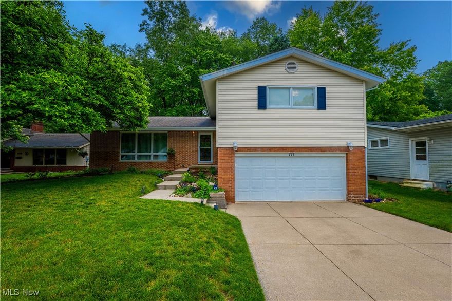Step into this beautifully well maintained 3-bedroom, 3-bath split-level home that blends comfort, style, and convenience. Featuring brand-new oak hardwood floors and a spacious open layout, this home is perfect for entertaining guests or enjoying quiet evenings in. Sunlight pours in through large bay windows, brightening the inviting living spaces. The eat-in kitchen offers ample room for meals and gatherings, with direct access to the deck-ideal for grilling or relaxing while overlooking the fenced-in backyard and the serene backdrop of the metro park. Upstairs, you'll find generously sized bedrooms, including a private master suite. With plenty of storage throughout, a finished lower level, and fresh landscaping that enhances curb appeal, this home is move-in ready. Don't miss your chance to own a peaceful retreat just minutes from city amenities!