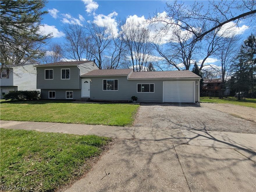 The minute you walk into the front door you can see how clean and well maintained this gorgeous split level is! Open floor plan allows all of the rooms to flow into one another! Sliding glass doors off of the sunshiny dining room that leads to the classy kitchen! Ample cabinet space with deluxe, pull-out shelving in the pantry! Truly a remarkable family room with custom barnwood steps and bench seat, stone fireplace and entry into the oversized one car attached garage with workshop area. The second level has three bedrooms and a full bath. Lower level would make a great rec-room, home office, exercise space or fourth bedroom!  Laundry/utility room would make a nice mudroom as it leads out to rear yard where there's a firepit and fenced in yard.  Total approximate square footage is 2148.  Furnace replaced in 2022 and a new roof in 2019.  Fresh paint throughout and carpet installed on stairs and all 3 bedrooms in March 2024.  Immediate occupancy! Just beautiful inside and out!!