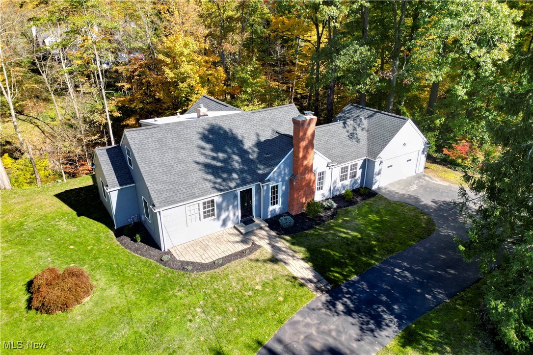 Welcome to your dream home. This move in ready spacious cape cod nestled on a 1.6 acre wooded lot offers the perfect mix of sun and shade. If you're seeking peace and tranquility you'll love the backyard composite deck overlooking a wooded ravine or soaking in the hot tub on the large back patio. Enjoy the natural beauty just minutes away from shopping, popular restaurants, golf courses, and the Metro Parks. This 5 bedroom, 2.5 bath home boasts an airy, spacious layout. This home was redone in 2019 including electric, plumbing, flooring, siding, roof, deck, patio and windows. Come see the beautiful kitchen featuring granite countertops and stainless steel appliances. Large living room with fireplace and nice sized bedrooms. Additional features include a first floor laundry room, large mudroom, pantry, shed with overhang for sitting and an electric vehicle charging station in the freshly painted, heated garage.