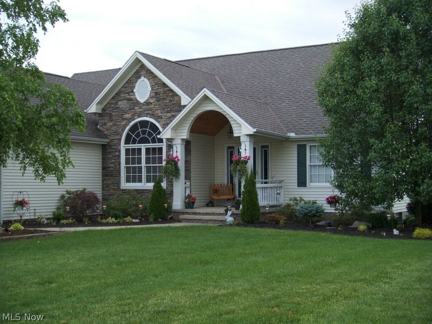 Professionally landscaped 3 acres surround a gorgeous 3 BR, 3-1/2 bath Ranch home. The updated eat-in kitchen has high-end granite counter tops, tile back splash, cherry Kraft Maid cabinets thru-out house, Granite sink, Pendant lighting.  There is a Hearth room off the kitchen with see-thru fireplace to the Great Room, which has vaulted ceilings. Trey ceilings are in the in formal dining room. Entry from garage leads to 'drop zone' with long counter/Kraft Maid cherry cabinets for storage/organization.  Master Bath has soaking tub/tile/skylight. Sliders from kitchen lead to 31x22 TREX deck with railing/lampposts. 95% efficient gas forced air Trane furnace installed in 2012. Lit stairs lead to the full finished basement which is carpeted and has glass block windows.  Mini bar area has wet bar/sink, stainless mini fridge.  Full bath has tile flooring, shower, Corian counter tops. New in2014...Security System, and screens on gutters. This home is immaculate, and has been meticulously maint