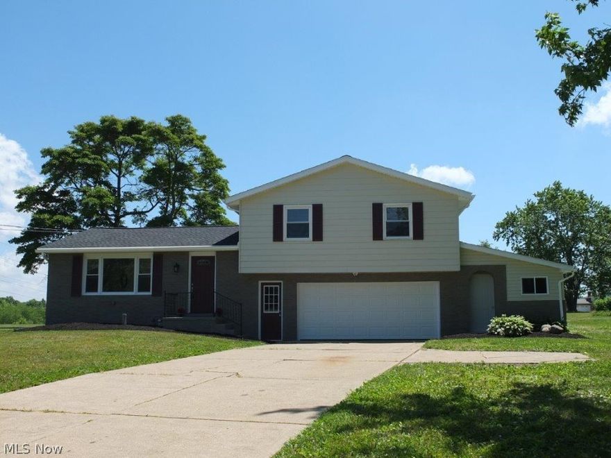 Completely remodeled 3 bedroom, 2 full bath home with open concept and spacious backyard! Open living room, dining room and kitchen. Kitchen with tile backsplash comes applianced with NEW stainless steel dishwasher, gas range, oven and over the range microwave and is open to the dining room with slider to the back deck. 3 generously sized bedrooms and remodeled full bath with dual sinks, solid surface countertops, tile backsplash and shower surround. Convenient additional full bath on main level with tile flooring and updated vanity. Finished lower level with huge rec room area and glass block windows. Updates include NEW A/C, roof, windows, kitchen appliances, flooring in the kitchen and bathrooms and more! 2 car attached garage, too. Spacious backyard with large storage shed and deck perfect for relaxing! Call today to schedule a private showing!