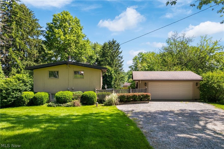 Nestled in the heart of New Franklin & mere minutes from Portage Lakes is where this charming home awaits you. Situated on over half an acre of land where the rear of the lot is wooded for privacy and there is ample room for the kids & pups to roam.  As you step inside, you’ll be greeted by an abundance of natural light from every angle. The main level boasts a sizable living room with a vaulted ceiling and glass door leading to a private deck. The kitchen, perfect for the aspiring home chef, features an array of cabinets, upscale stainless steel appliances, granite countertops, a tile backsplash, undermount double sink, and stylish black hardware.  Two bedrooms with double closets and a full bathroom complete this level.  The lower level offers a cozy family room with a floor-to-ceiling stone wood-burning fireplace and access to the backyard. A sizable bedroom and attached full bathroom are conveniently and privately located on this level.  An oversized two-car garage provides ample space for your vehicles and storage needs. Act quickly because this gem is bound to sell fast!
