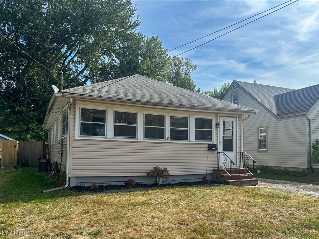 Discover the charm of this cozy 2-bedroom, 1-bath bungalow, perfectly located near schools, downtown, shopping and major routes. This inviting home features an enclosed front porch, a spacious living room, and a large eat-in kitchen. Enjoy the benefits of updated flooring and a newer bathroom, along with a basement for additional storage and a garage for your convenience. The private backyard offers a serene escape, making this property a perfect blend of comfort and practicality.