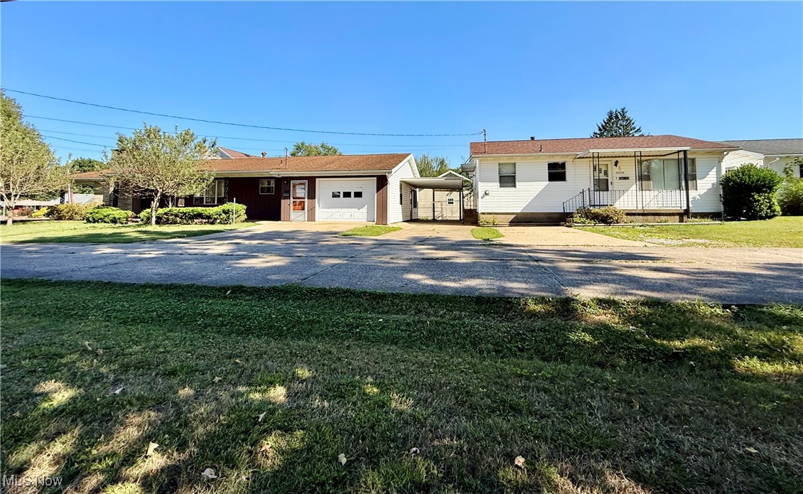 This listing will have you seeing double! Why settle for one ranch home when you can have two? This rare opportunity offers not just a charming main residence but also a full second home that is perfect for extended family, a mother-in-law suite, or a rental to offset your mortgage. The main home features 3 bedrooms, 2 full baths, a formal living and dining room, plus an oversized eat-in kitchen that flows into a fireside family room. Set on a desirable corner lot, it boasts a large front lawn, attached garage, carport, and not one but two inviting patios. The second home is equally appealing, offering 2 bedrooms, 1 bath, a comfortable living room, eat-in kitchen, and its own laundry room. With off-street parking and a welcoming front porch, it’s a move-in ready space with endless possibilities. Opportunities like this rarely come around. Whether your lifestyle calls for dual living arrangements or you’re seeking a smart addition to your investment portfolio, this property is truly one-of-a-kind. Don’t miss your chance to make it yours!