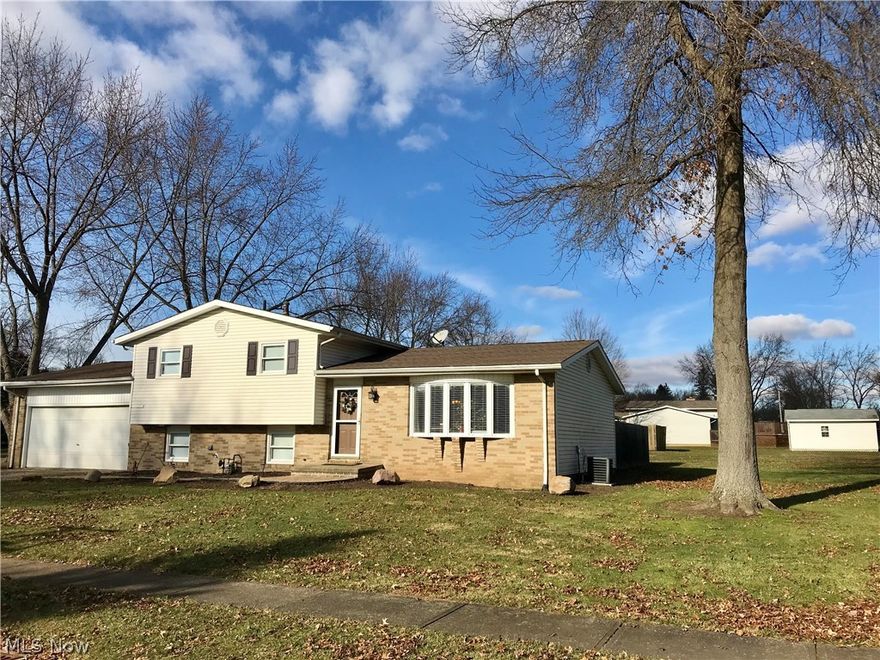 Nice spacious home in convenient Louisville location. Open floor plan updated throughout. 3 large bedrooms, 2 full updated baths. Beautiful kitchen w/stainless appliances. 1573 square feet of living space. Custom woodburning fireplace in family room. Attached 2 car garage. Walkout onto deck from large dining area.  Large lot w/privacy fence, note the lot goes beyond the fenced area. Schedule your showing today! Sellers entertaining all offers!