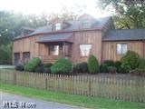Motivated Seller , could be a short sale, seller has already begun paperwork and communication with bank. Owner is replacing electric box and having a pest treatment completed. Inspections have been done. Home is very unique with a cabin feel, wood décor throughout. Large eat in kitchen with lots of windows viewing the backyard. Lot is half an acre. First floor bedroom and bathroom. Walk out basement could be finished. The garage is every mans dream! Big and tall. There is an unfinished addition being used as an attic but could be a fourth bedroom. Seller has had offers but the time frames of move in dates and needed repairs did not work.