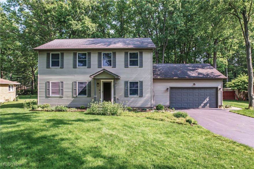 Welcome to this beautifully maintained 4 bedroom, 3 ½ bath home in a desirable Howland neighborhood. Lovely hardwood floors grace the entire first floor, including the stairway to the second floor. With an eye-catching gas fireplace and crown molding, the family room is open to the eating area and kitchen. The kitchen has stunning granite counter tops, oak cabinets, and a large island. The appliances stay, including a gas range and newer refrigerator and microwave. Sliding doors off the eating area lead to a concrete patio with built in lights and a gas line for your grill. Enter from the attached two car garage into a mudroom/laundry room on the first floor that includes a sink, washer, and dryer. The second floor is carpeted and includes a large primary suite with cathedral ceilings, a walk-in closet and ensuite bathroom. Three additional bedrooms include custom built-in cabinets and desks in two of the bedrooms. A large full bathroom is accessed from the hallway. The basement is partially finished and includes a full bathroom, plenty of storage as well as space for a workshop. The electrical panel includes an energy load saver and in addition to the main gas shut off valve, each line can be turned off independently. Recent updates include HVAC (2019), hot water tank (2022) and sump pump (2025). The shed remains with the home as well as the snowblower, leaf blower, and spreader. Refrigerator in the garage conveys. Schedule your showing today!