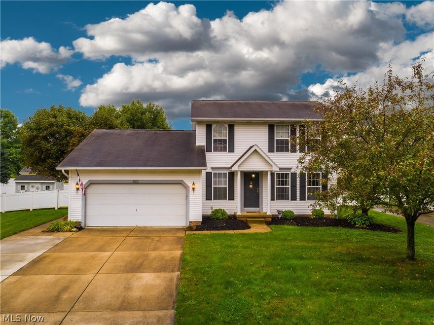 Welcome to this beautifully maintained colonial in the heart of Canal Fulton! 3 bedrooms and 3 bathrooms and plenty of space to entertain! Open the door and head into what is being used as a second living area, but could easily be utilized as a formal dining room or office space. Plank flooring runs throughout and into the eat-in kitchen, where there is an immense amount of cabinet and counterspace, including a large pantry. The eat-in kitchen opens right up to the family room that includes a beautiful gas fireplace and window treatments throughout. First floor laundry and a half bathroom finish the first level. The master bedroom is generously sized with vaulted ceilings and a private bathroom. Both upstairs bathrooms have updated, modern, tile flooring. So many updates throughout the entire home! To top it off, there is a finished basement with extra living space, an area roughed in for a fourth bathroom, along with a storage area completed with new shelving. Enjoy the Fall weather o