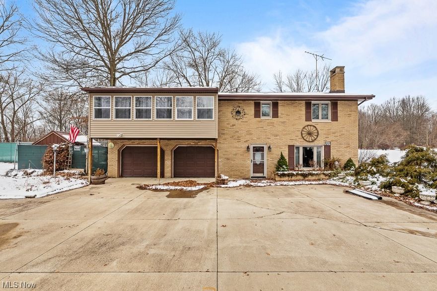 PRICED TO SELL!! Welcome to the Lake House of your dreams!  This raised ranch has so much to offer, close to town, check, on the lake, check, multiple outbuildings, check one floor living, check. The home has a total of 5 outbuildings! Drive down the winding concrete drive added in 2013 spared no expense! When you pull up to the raised ranch you enter into the basement. Large family room with a wood burning fireplace that can heat the entire home! You have a full kitchen in the basement with all appliances! Full bathroom and the laundry room! You have access to enter into the 2 car deep garage attached to the ranch as well. walking up the stairs you have a large walk-in pantry, making your way to the left you have your large eat in kitchen and a good size enclosed porch! On the other side is a large living room with a bay window and door to the porch that has a fenced yard for the kiddos or pets! Down the hall you have a full bathroom three good sized bedrooms and the master bedroom has its own large master bathroom! If you have a mother-in-law needing to move in, the basement eat in kitchen area could easily add walls and turn it into a bedroom, would have a kitchen bathroom and living room! House was completely gutted and remodeled in 2011, including electrical, plumbing, roof, windows, doors, trim, floors, everything! The house faces the old road to the back Odnr. you can access Odnr road through the yard. There is a launch for the boats and jet skis right in front of the house on Odnr. There is no dock with the home because it is considered a nature preserve. There will be no neighbors between the water and you as the woods are owned by Army Corp. Wait until you see this home in the spring, with all the beautiful flowers and trees! Don't miss the opportunity to own a house on the Lake for the soon coming lake season.