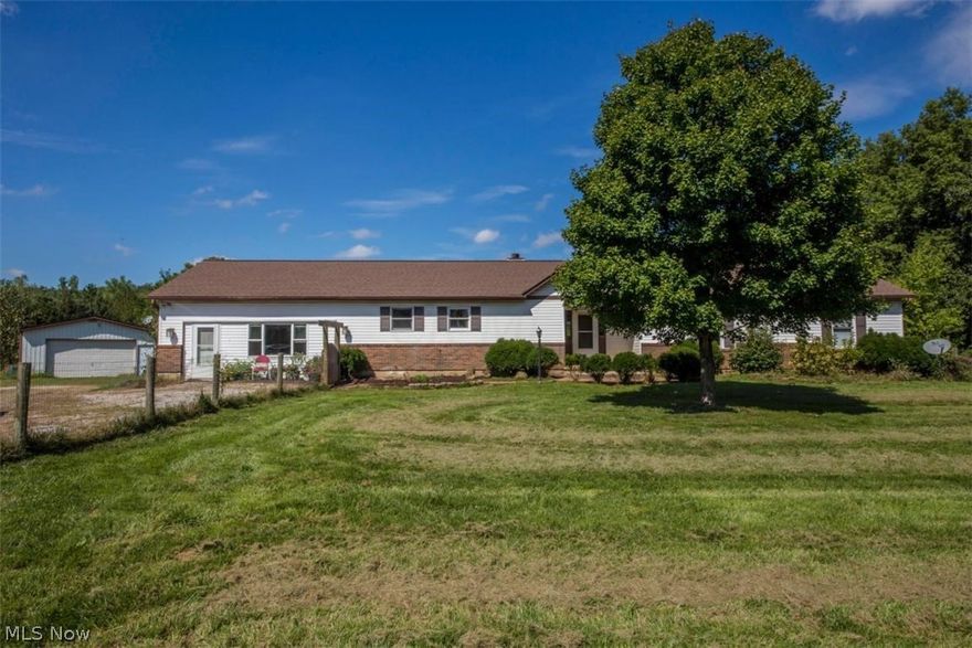 Private 5 acre country retreat just minutes from Delaware & Marysville. Pine trees line the left and large Oak trees to the right of the property! Updated ranch featuring a spacious family room w/brick fireplace, dining room, walk in pantry & 1st flr laundry rm. You will enjoy the 3 season room w/ views of the stocked pond where you can fish, swim & watch the wildlife! 2 ½ baths and 3 spacious bedrooms including an en suite master w/ walk-in closet & private bath complete the main floor tour. Full basement has plenty of storage & is partially finished just waiting for you to make it your own. Lg pole barn for parking w/ pellet stove, work bench & storage. Predator proof chicken coop. New roofs-house & pole barn (2012), HVAC (2015), sump pump (2108). A must see!