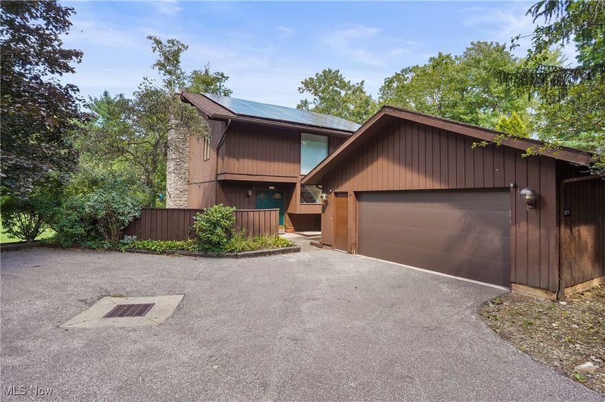 Welcome to your dream home! This stunning property boasts beautiful hardwood floors throughout the living room, dining room, and family room, offering a seamless flow for everyday living and entertaining. The updated kitchen and bathrooms add a modern touch, while the cozy fireplace downstairs creates a warm ambiance. The first floor also features a convenient 1/2 bath.

Upstairs, you'll find an inviting office space with high ceilings and abundant natural light, creating a peaceful and open atmosphere. The master bedroom is a true retreat with its own fireplace, walkout deck with a serene lake view, and an ensuite bathroom with a spacious closet. Three bedrooms and a full bath complete the upper level, ensuring plenty of space for everyone.

This home is not only beautiful but also energy-efficient, with a fully functioning array of solar panels on the roof providing nearly all the energy needs for the all-electric condo. Updated and well-maintained HVAC systems keep utility costs to just a few hundred dollars per year.

Don't miss out on this one-of-a-kind home with its blend of elegance, comfort, and breathtaking surroundings!