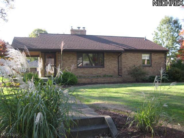Impressive Brick Ranch built in 1953 & lovingly cared for - 2 bedrooms. large closets. One bedroom's carpet has been removed to show beautiful hardwood flooring.Living room fireplace has gas logs. Nice sized kitchen, ample cupboards with dinette. Fresh paint in lower level. Second fireplace is wood burning, area for new bathroom, commode already in place, Lots of possibilities. Work bench will stay. Two car garage, door opener and built in storage cabinets. Asphalt drive way will be resurfaced. Large covered porch accommodates front door and side door. Great flat landscaped lot & shed. Newer roof. Extra storage in attic with pull down stairs. Quick Possession!! Come take a look.
