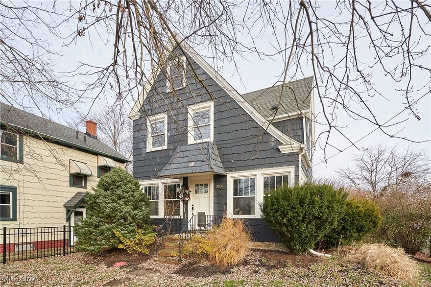 Cozy 3-4BR 1BA tudor-style colonial on a fenced-in corner lot in the upper-east side of Cuyahoga Falls! Featuring beautiful hardwood floors throughout, spacious living room spanning the width of the house w/ fireplace, recessed lighting, 2 fans, and tons of natural light, light and airy kitchen w/ corian counters, glass subway tile backsplash, mostly SS appliances, formal dining room, updated full bath, master bedroom w/ 2 closets, 2 add’ bedrooms on the 2nd level plus a finished 3rd floor that could also function as a 4th bedroom.  Some add’l updates include the addition of AC '25, vinyl windows, waterproofed basement '23, and all new plumbing. Conveniently located 200’ from Lincoln Elementary School, less than 1 mi from Rt. 8, and 10 minutes from downtown Akron.