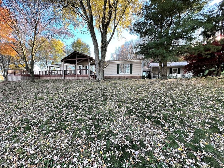 100 acres on the tri-state border. Back the long country driveway sits a ranch-style home, a horse barn, a machine shed, a feed shelter, a chicken coop, and much more. The ranch-style home offers three bedrooms, two full bathrooms, an eat-in kitchen, a dining area, and a living room with a wood burner, mud room, breezeway, owner suite, two-car garage, workshop, and large wrap-around deck. The horse barn has five stalls with options for more, a loft, water, an attached machine shed, and a heated tack room. The property was used as a horse riding camp by the current owner. The owner would ride her horse to Beaver Creek from the property!