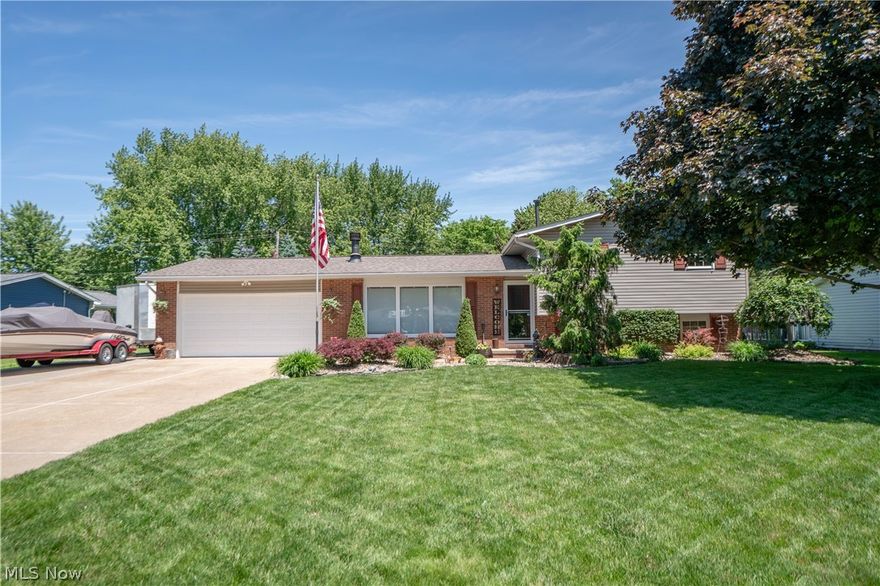 Beautifully cared for and filled with inviting spaces, this split-level home offers comfort inside and a backyard retreat that feels like your own private escape. Step into the cozy living room where a wood-burning fireplace creates a warm focal point for everyday living. The eat-in kitchen offers plenty of cabinetry, black stainless steel appliances, a coffee bar area, and easy access to both the garage and backyard.
Upstairs, three comfortable bedrooms provide a peaceful place to unwind, including a primary bedroom with direct access to the shared spacious full bath. The lower level adds even more flexibility with a rec room or office space, fourth bedroom, full bath, laundry room with a crafting/workshop space, and built-in safe. Outside is where this home additionally shines, featuring an expansive deck, concrete patio with pergola, pond with waterfall, brick paver patio with built-in fireplace, and a large shed with electric. A wonderful blend of cozy indoor living and beautiful outdoor enjoyment!