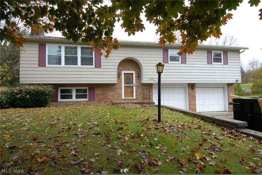 Bi-level home in established neighborhood with nice size living room, dining room with slider to rear deck, eat-in kitchen with stove, refrigerator, microwave, three bedrooms and full bath.  Master bedroom has Jack'n Jill bath with ceramic tile flooring, open to hallway.  New carpet in living room, dining rom and bedrooms.  Lower level offers L-shaped family room with fireplace and new carpet.  Utility room with laundry hookup.  two car attached garage.  Some updates to kitchen and baths.  Priced to sell!