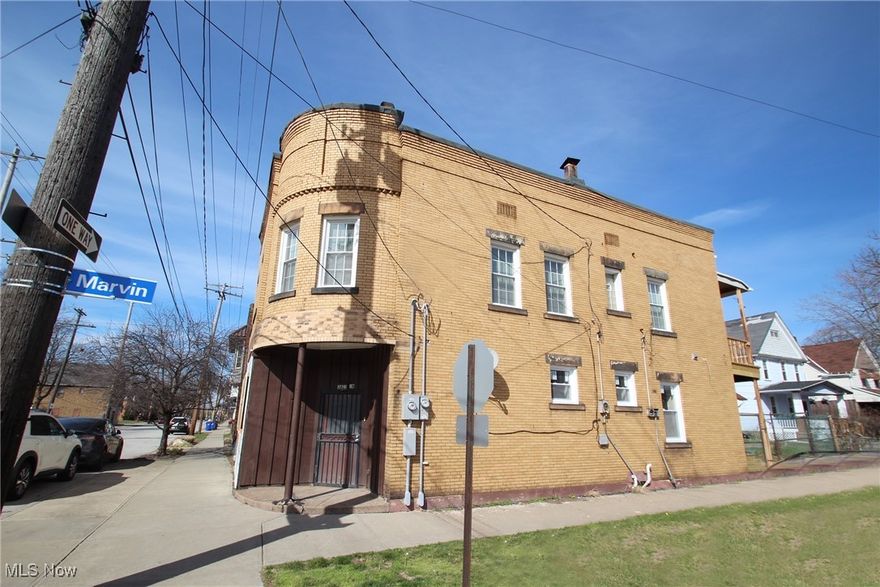 The property has undergone a comprehensive renovation, featuring all-new HVAC systems—including ductwork, furnaces, and air conditioning—with separate setups for commercial and residential use. All mechanical work was completed to commercial-grade standards by BNK Contractors. A brand-new roof has been installed, along with replacement of every window throughout the building and the addition of extra windows to enhance natural light. The commercial unit was fully gutted down to the studs and rebuilt with new drywall and ceilings, incorporating a firewall between units in compliance with city code and adopting an open floor plan concept. All renovations were inspected and approved by the city from the outset, ensuring full compliance with occupancy standards. The exterior now boasts high-end stonework for added curb appeal, while the entire building has been outfitted with modernized electrical wiring and upgraded lighting, including recessed fixtures and ample outlets to support contemporary business needs. Fresh paint has been applied throughout, and the plumbing system has been completely replaced, including the addition of a new commercial-grade bathroom. The upper residential unit was also gutted and renovated, featuring a brand-new kitchen with granite countertops, new cabinetry, and updated appliances including a dishwasher. A secured balcony and stairway provide access for the rear tenant, and a washer/dryer room has been added on the second level for convenience. Original floors have been sanded and restained to preserve character, and goose-neck lighting has been installed on the building’s exterior for aesthetic appeal. Additional enhancements include driveway access and the potential for an open patio area on the side of the building, adaptable to various business models. The basement offers 1,120 square feet of clean, dry, and secure storage space, available for use at the commercial owner's discretion.