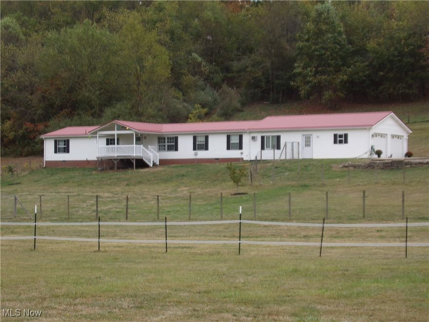 First time on the market! This spacious 4 Bedroom, 2.5 Bath ranch is nestled on 4.5 acres, offering the perfect blend of country living and modern comforts. The open-concept layout, remodeled in 2015, features granite countertops, custom cabinets, and custom bar stools. Enjoy the outdoors on the covered front porch or large rear deck, equipped with 220v for hot tub. A large portion of the front and back yards are fenced. A durable metal roof was installed in 2023. 
The property inclueds a child's log cabin, animal run-in with solar electric fence, and a 12 X 16 climate-controlled building. one bedroom is soundproofed, ideal for amusic room. Plus, the oversized, insulated two stall garage boast a bonus room, attic, and half bath.
Don't miss this unique opportunity!