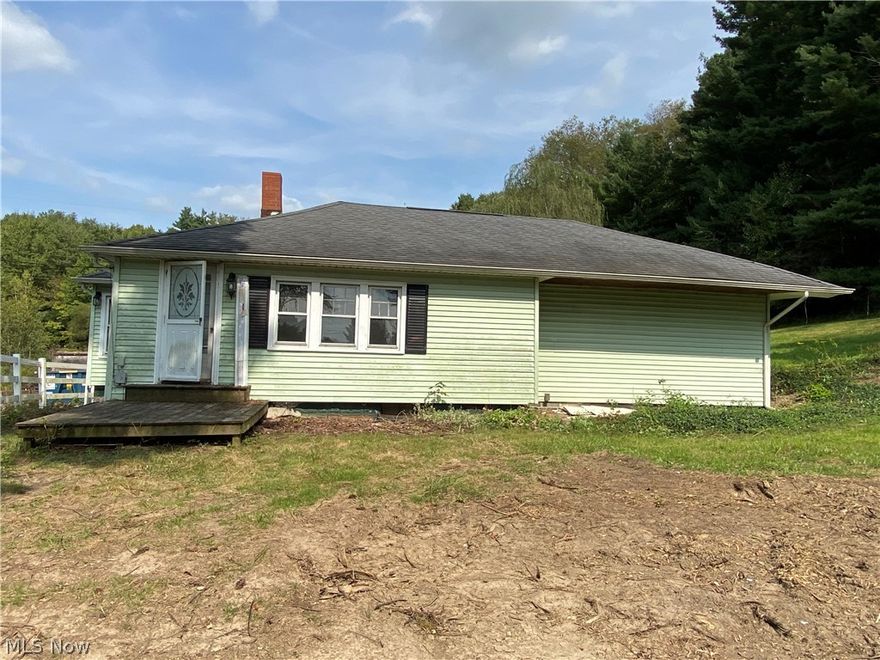 Get a little piece of the country but be near to the city.  3.9 private acres.  House has all new paint and flooring.  Kitchen has new backsplash.  Extra room can be a dining room, a den or even be enclosed for a 3rd bedroom.  Property also offers a large barn.