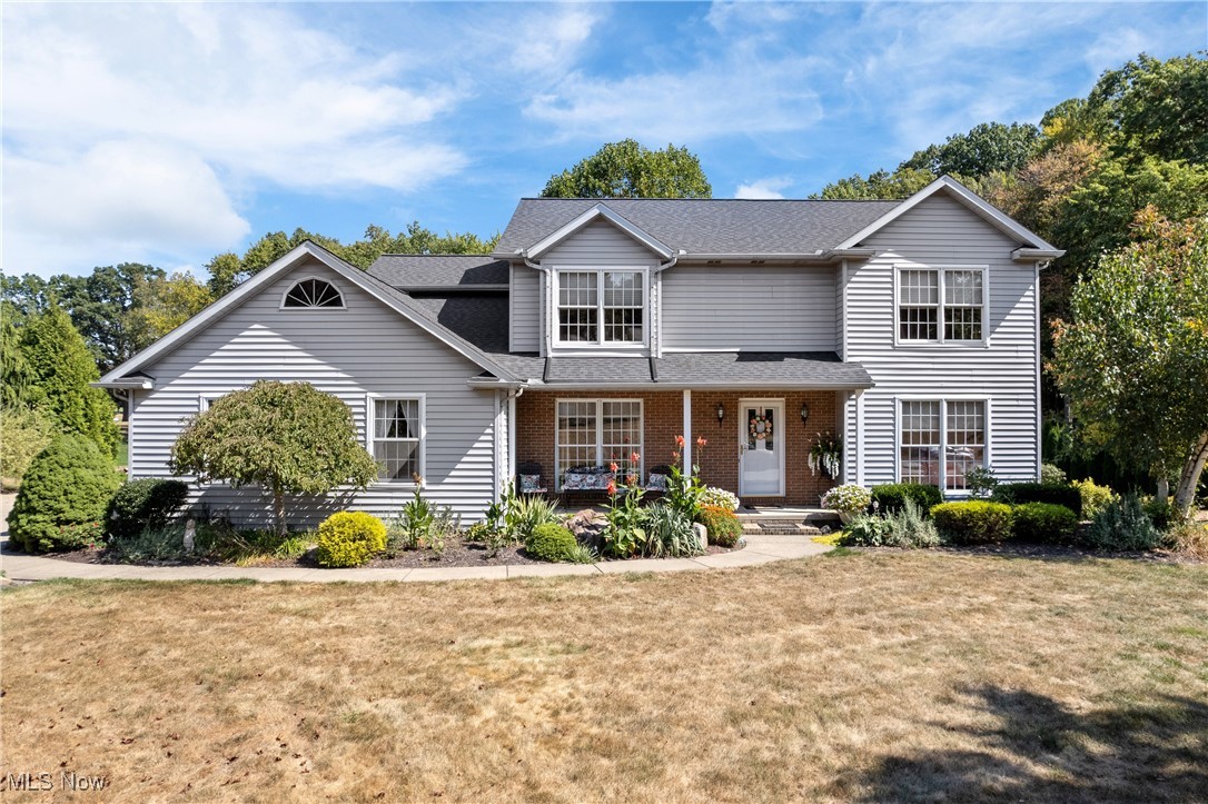 Look no further! This custom-built 5-bedroom, 4-full-bath home is not only in impeccable condition, but also ideally situated on nearly 1.25 acres in the desirable Green Local School District. Nestled along the scenic Mayfair Golf Course with a private, stocked pond and your very own fully refurbished covered bridge (2024), this one-of-a-kind property offers both charm and tranquility. The home features great curb appeal with professional landscaping, an oversized 672 sq. ft. side-entry garage, and a large concrete driveway. A brand new 12x10 shed with electric was added in 2023, and the newly covered back porch (2024) provides stunning views of the pond and golf course—perfect for relaxing or entertaining. A new architectural shingle roof was also installed in 2024, adding long-term value and peace of mind. Inside, you'll find an updated eat-in kitchen completed between 2024 & 2025, featuring leathered granite countertops, a stylish glass tile backsplash, and brand-new refrigerator, cooktop, vent hood, sink, and microwave. Just off the kitchen is a light-filled sunroom, while the spacious great room offers a cozy gas fireplace. The 1st floor also includes a bedroom, full handicap-accessible bathroom, and laundry area, with new carpet installed in both the bedroom and great room in 2024. Upstairs, the master suite features vaulted ceilings, a walk-in closet, and a beautifully remodeled bathroom with a double vanity and separate shower. Three additional bedrooms and another full bath complete the second floor. The finished 12-course basement includes a family room, recreation room, a sixth bedroom, and yet another full bathroom—providing plenty of space for guests & entertaining. The home is powered by 2 electric panels, one 200-amp & one 100-amp. Whether you're fishing from your private pond or teeing off just steps from your backyard, this exceptional home truly has it all. With every major update already complete, there's nothing left to do but move in and enjoy.