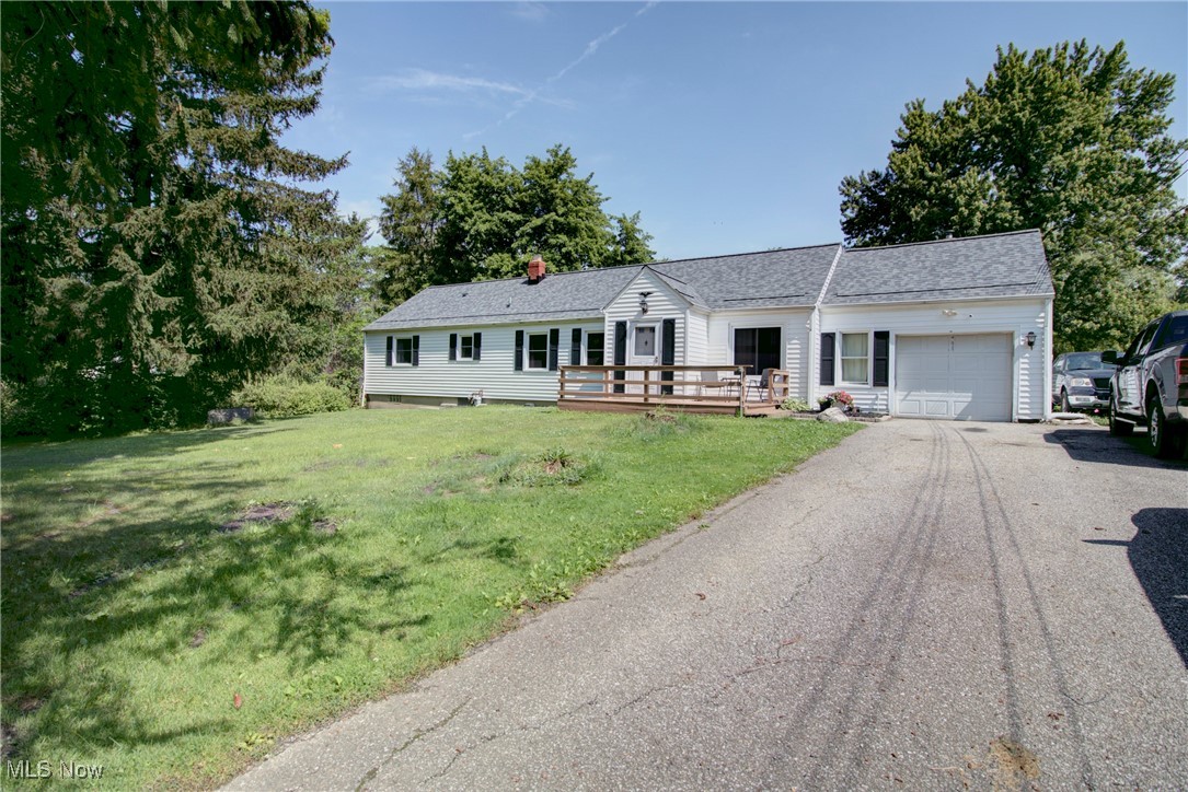 This cozym rustic Chesterland ranch has all the warm vibes with huge wooden headers throughout, country wooden cabinets in the kitchen, and a barn door to separate the rear living space from the front. There are 4 bedrooms, a room that would make a great office space, music room or play area with a pellet stove, two full baths (one having a tub while one has a walk-in shower), both a living room and family room, and a proper dining area and kitchen. The basement has walk-out access and great space for additional storage or perhaps a bit of living space! This home sits on 2.4 acres and well off the street with a large front deck to relax on. There are sliders that exit to the rear deck from the family room where there is a lot of green space before the trees and much more beyond that. You have the benefit of receiving free gas each year with gas well rights, to boot! The electrical, flooring in the kitchen and family room and new roof were updated in 2025, windows in 2015, septic in 2006, a new well pump in 2020, and there are additional heat sources besides the boiler heat with a pellet stove in bonus room and wood burning stove in the family room. The basement was waterproofed in 2006 with a transferrable warranty and this home has a water softener, as well. This is truly a wonderful place to call home!