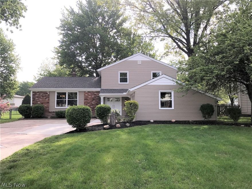 Featuring this Split in the desirable Bretton Ridge development of North Olmsted.  This home is basically brand new, as it was stripped down to the studs and re built.  As you enter the new double entry doors you step onto hardwood floors in the foyer.  There is a large bedroom right off the foyer that would be perfect for in laws, a teenager or as office space.  Step us a few carpeted stairs and you're in the large living room with hardwood floors.  There is a formal dining room off of the kitchen which features hardwood floors as well.  The kitchen has ceramic floors, a stainless steel appliance package, custom cabinets with soft close drawers and granite.  It overlooks the family room which features a brick wall fireplace and sliders to the attached 3 season room.  Upstairs features 3 bedrooms with nice sized closets and a full bath.  Upstairs is also the Owner's Suite which features a full en suite bath.  In the lower level of the home you'll find the laundry room, a bonus room and