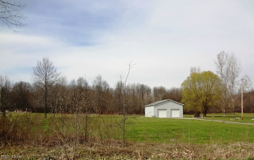 Enjoy 5.25 acres -- Rolling land has it all -- open rolling land, woods.  Get ready to build your dream home.  Great for animals or to just enjoy nature.  The garage is already built.  Pole building with electric, heat, overhead door and concrete floor.