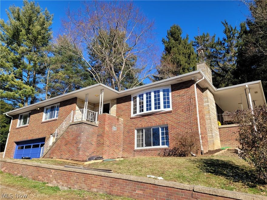 Spacious, brick, raised ranch home with 4 bedrooms and 2 1/2 baths.  New 30 year shingle roof - 2020.  Some windows have been updated.  Hardwood floors throughout.  Fenced in back yard with a patio and a covered side porch with beautiful views of the Ohio countryside.  Rec room in basement can be turned into whatever you would need.  Oversized 2 car garage is a nice added bonus to this property.  Dry basement.  2 chicken coops and 1 outbuilding will remain at the property.