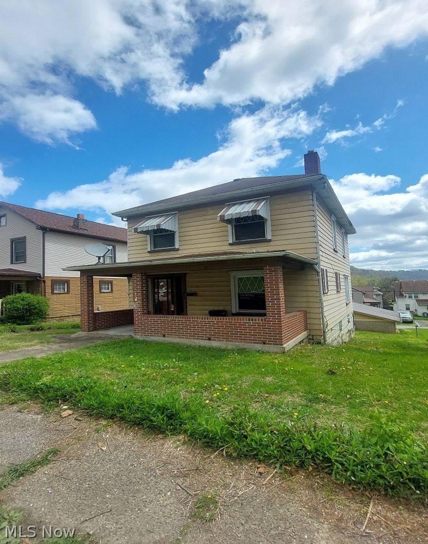 Two-story aluminum-sided home featuring 3 bedrooms and 1.5 bathrooms. The interior is currently under renovation, with the kitchen removed and ready for remodeling. The home does not have a furnace or central air, offering a blank slate for installing your preferred HVAC system. This property has strong potential as a rental or investment opportunity. The exterior is in average condition. Additional features include a detached 2-car garage with alley access.