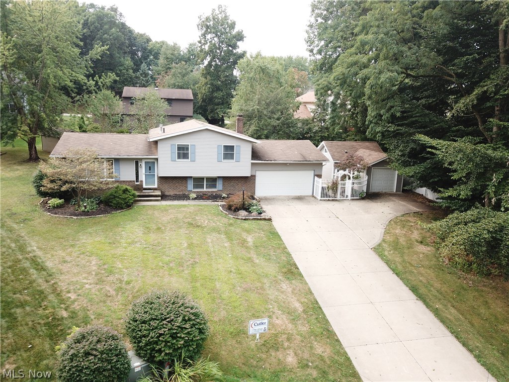 WOW! This gorgeous newly-renovated 4 bedroom, 4 bath split-level home is conveniently located in North Canton LSD. The home features an impressive in-ground heated pool nestled away on a treed lot on a private cul-de-sac. You are sure to be blown away by all of the updates! You are welcomed in with the expansive modernized kitchen that showcases a 7-foot eat-at island, new stainless steel Frigidaire appliances and contemporary Fasade backsplash. The centerpiece of great room is the stunning gas burning fireplace with brick surround. This incredible room was made for entertaining! The lower level also features a bedroom and full bath. The master suite and two additional bedrooms that feature plush carpeting and closet space are situated on the upper level. Outside you will find the expansive back deck that is perfect for entertaining guests, as well as a pool house. The pool house is furnished with a full 3 piece bathroom, recreation room, extra garage space and finished loft area. This one of a kind home is everything you've been searching for, you do not want to miss out!