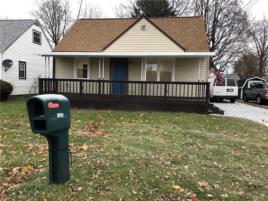 Total remodel! Bungalow with darling front porch, new white kitchen cabinets with quartz countertops, full bath remodeled, all new flooring, carpet, furnace. New roof, windows, plumbing, electric. Ready to move in! One car garage. Super location, easy to show.