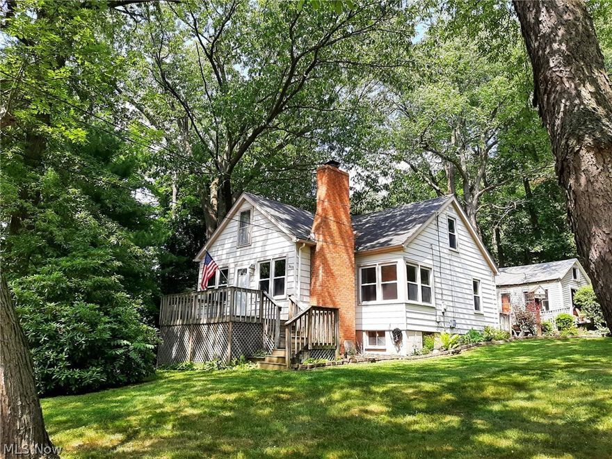 Picture perfect Cape Cod nestled deep atop a beautiful private lot! The updates are endless & most recently (since Fall 2020) include a new furnace & new gas lines, A/C, water softener, luxury vinyl plank flooring throughout the first floor & carpeting on the 2nd floor. Interior paint, electric panel, some wiring, some fixtures, baseboards/trim, full size walk-in shower w/surround & a front load washer & dryer set that is located in the first floor laundry/mudroom & are included with the home. Other updates in the recent past:  kitchen remodel & appliances, exterior doors, various windows. There is a large eat-in kitchen, living room w/corner windows, a wonderful family room with fireplace & a slider to private deck with lake view. The laundry/mud room located behind the kitchen has a French Door leading to another private deck which spans the length of the home & looks out into the gorgeous back & side yards that include numerous mature trees. There is an area enclosed with chain link