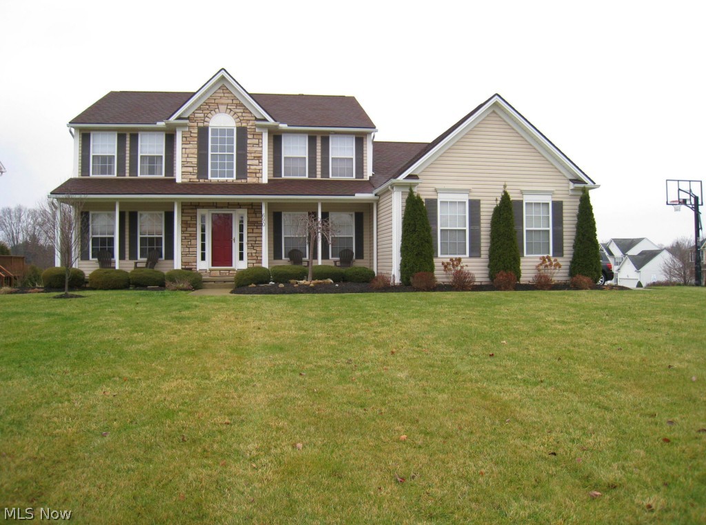 Gorgeous stone and vinyl 4 bedroom 2.5 bath colonial with a 3 car side entry garage in Pheasant Hills. The perfect floor plan includes a spacious 2 story foyer with hardwood floors, a private office with french doors, formal living room, large dining room, roomy kitchen PLUS a family room with a cathedral ceiling and gas fireplace. The lower level adds another 1,300+ square ft of finished space including a large rec room and office/play area. Nice master suite with vaulted ceiling, walk in closet and glamour bath with his and hers sinks, soaking tub and separate shower. Nice lot includes a new pool, deck and 6' privacy fence. Call today for a private showing.